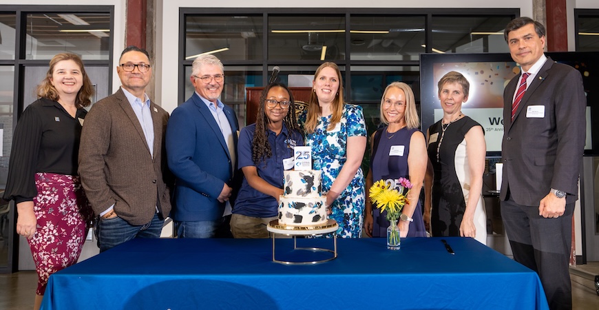Depicted are UC Merced and CITRIS representatives around a cake commemorating the organization's 25th anniversary.